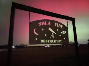 Sola Fide Sign Sola Fide Observatory sign hanging with the northern lights behind it.